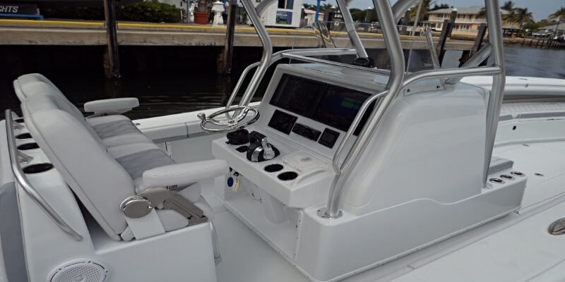 Marine surveyor capturing inspection images and video of boat interior in Stuart Florida.